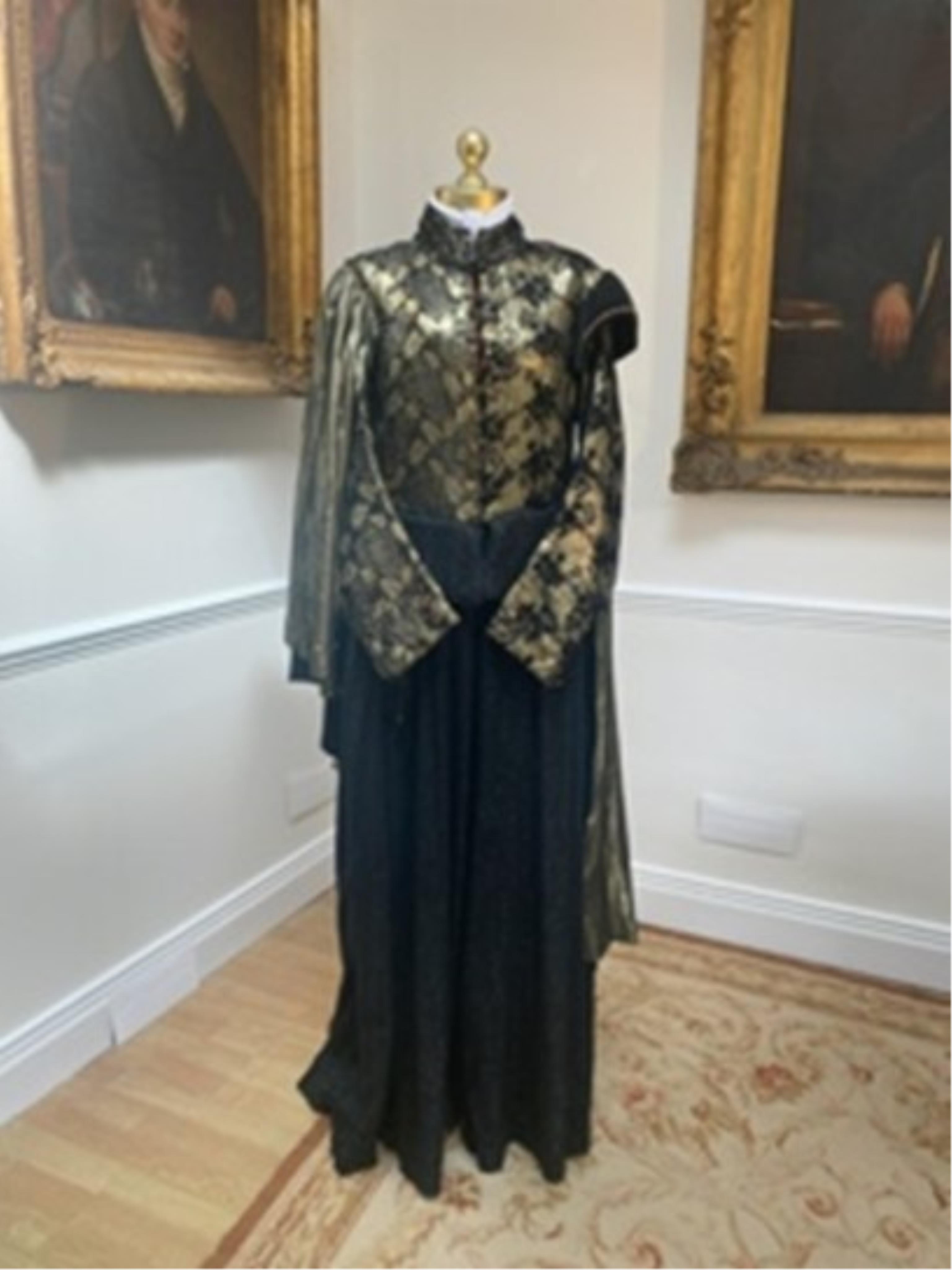 A men’s robe in gold brocade with decorations. Size Medium. Bought from the National Theatre